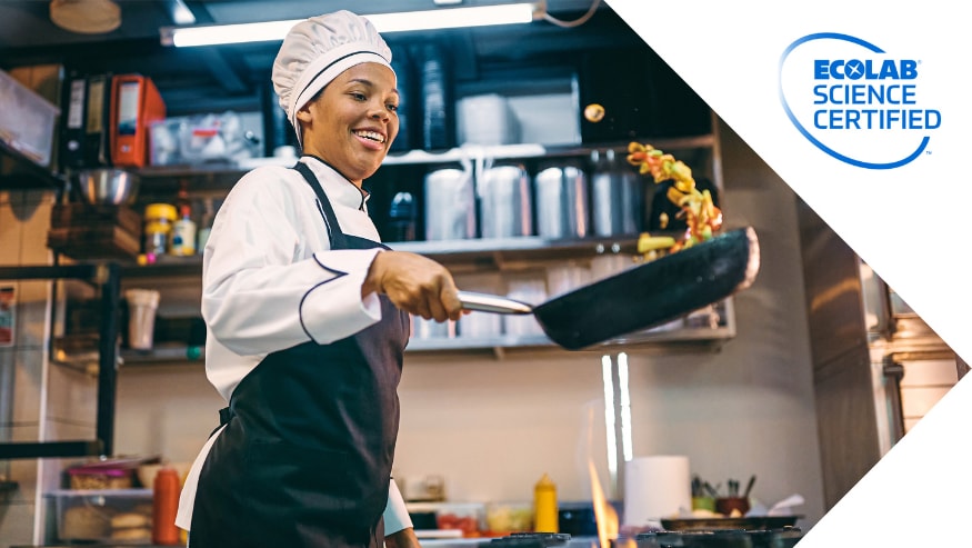 A chef cooking in the kitchen of a restaurant