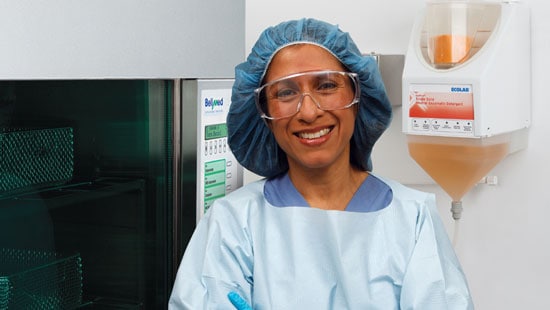 Central Sterile Department Manager standing by Belimed Washer Disinfector