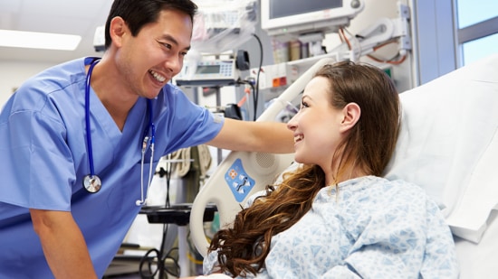 Doctor Speaking to Patient in Patient Room