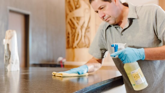Man cleaning with an Ecolab product