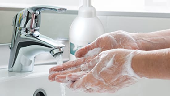 washing hands in a sink