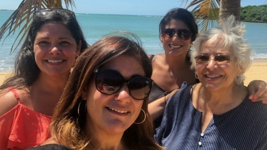 Pictured is Pariseau, far left, with her sisters and mother on a recent trip to Puerto Rico