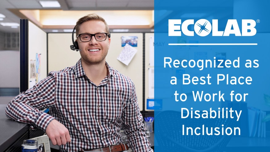Man wearing a blue tooth headset while sitting in a cubicle, overlay text that reads "Ecolab Recognized as a Best Place to Work for Disability Inclusion."