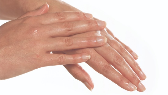 rubbing hands for gel and foam commercial hand sanitizers