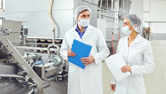 processing facility staff with masks