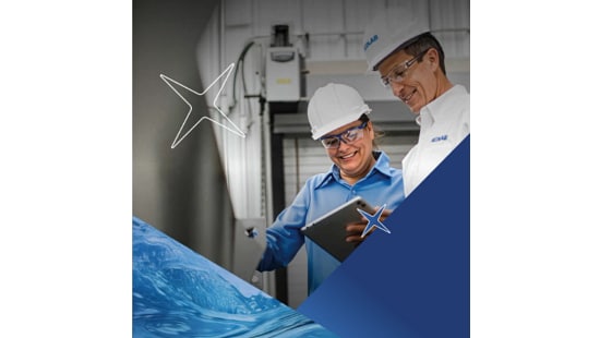 Two people in safety helmets reviewing information on a tablet in an industrial setting, with machinery in the background and abstract star and water-themed design elements.