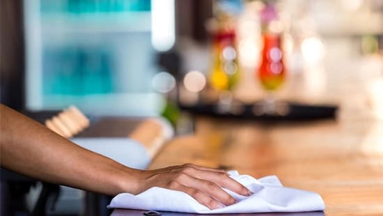 Cleaning counter in restaurant