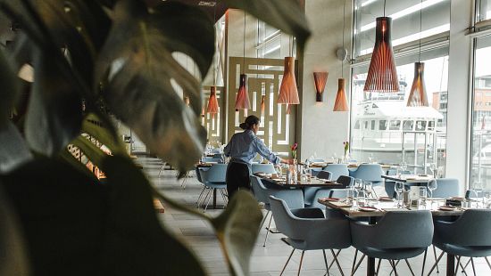 server preparing restaurant for opening