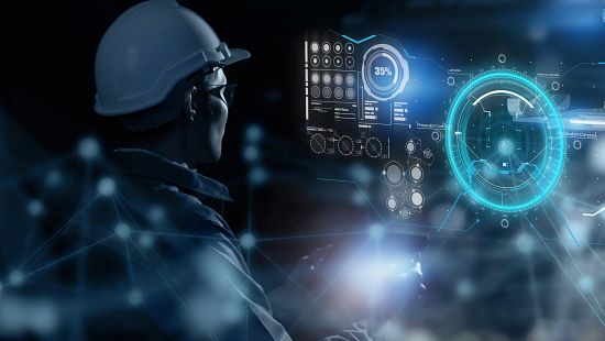 Engineer reviewing information on screen.